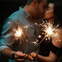 Couple with sparklers kissing Couple with sparklers kissing