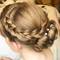 Bridal trends – Hair by Kelly – a plaited bun with white flowers Bridal trends – Hair by Kelly – a plaited bun with white flowers