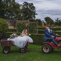 Couple on tractor outside of County Durham hotel Couple on tractor outside of County Durham hotel