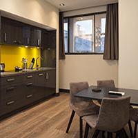 Roomzzzz aparthotels are ideal for a stag or hen party - lounge/kitchen area Roomzzzz aparthotels are ideal for a stag or hen party - lounge/kitchen area