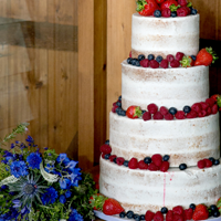 Stable Cottage 4 tier Vegan Wedding Cake Stable Cottage 4 tier Vegan Wedding Cake with summer berries and flowers