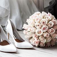 Wedding shoe and pink bouquet Wedding shoe and pink bouquet